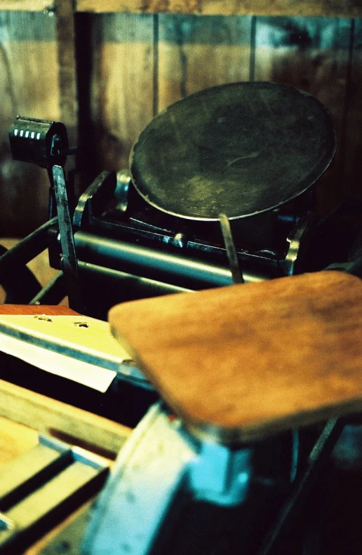 a musical instrument sits on top of an old stool