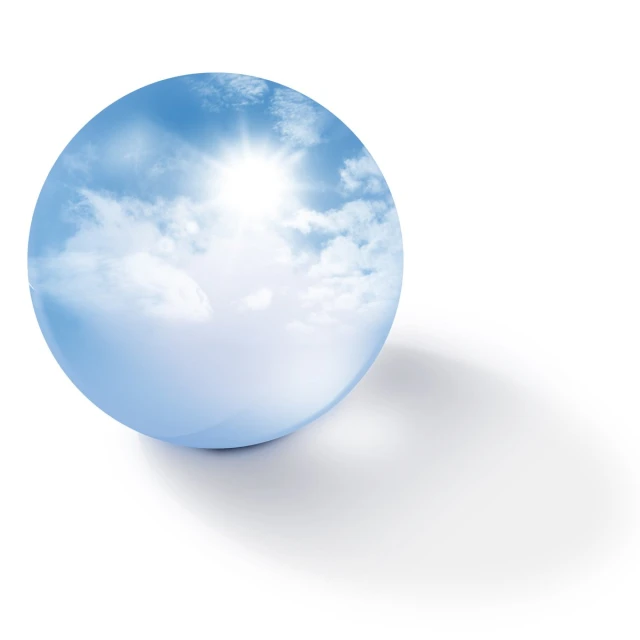 a blue round object with clouds on it