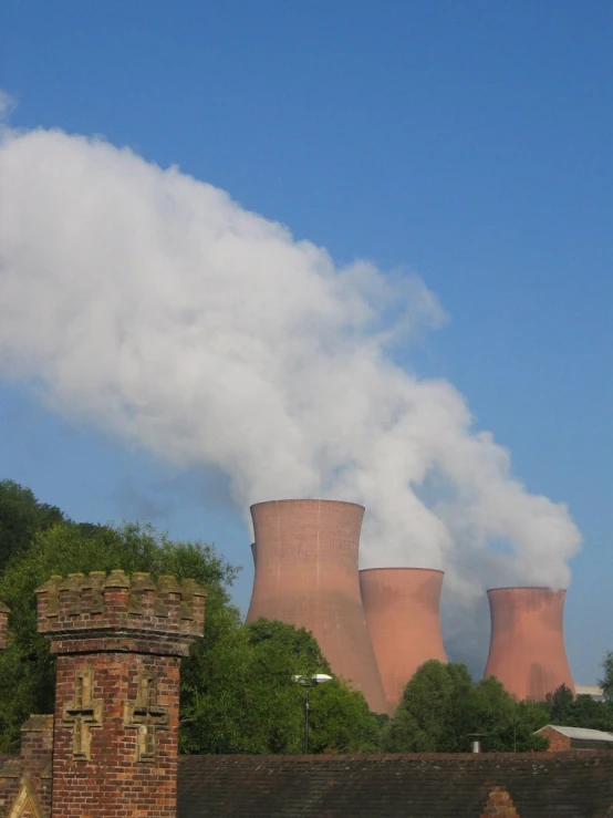 smoke is seen billowing out from the stacks of cooling equipment