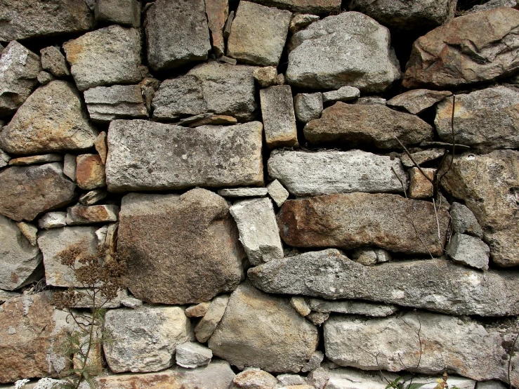 stone brick wall with several large rocks