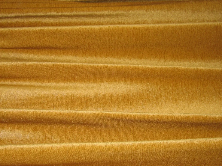 a closeup view of a plain yellow curtain