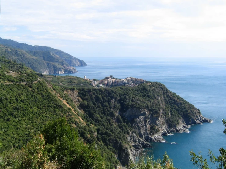 the ocean and shore of a mountain town