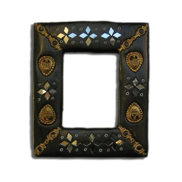 an ornate black metal frame with golden and silver decorations