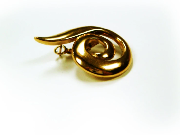 a gold ring has a knoted end