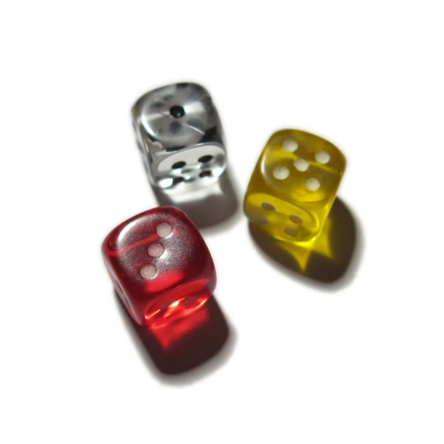 a set of three shiny dices with holes