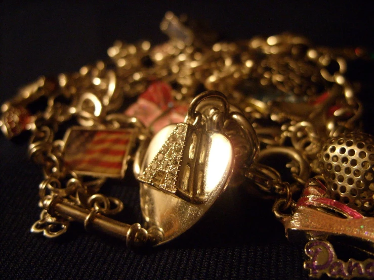 many gold colored jewels and a heart lock