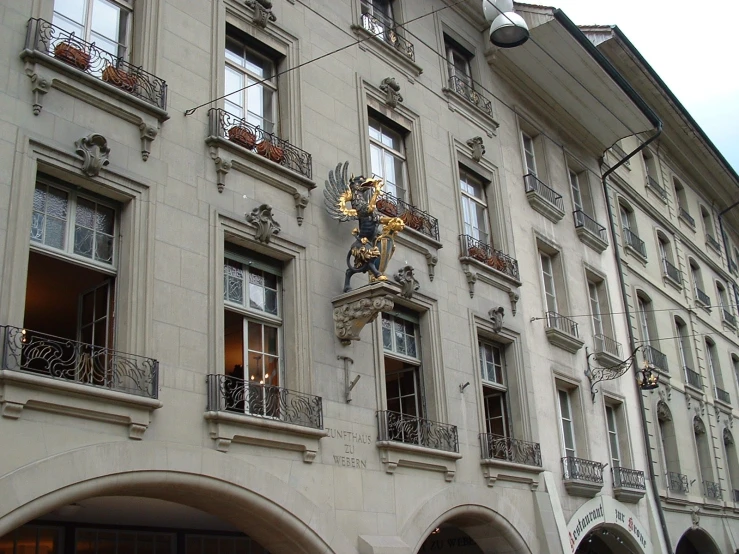 an ornate building with a balcony and many windows