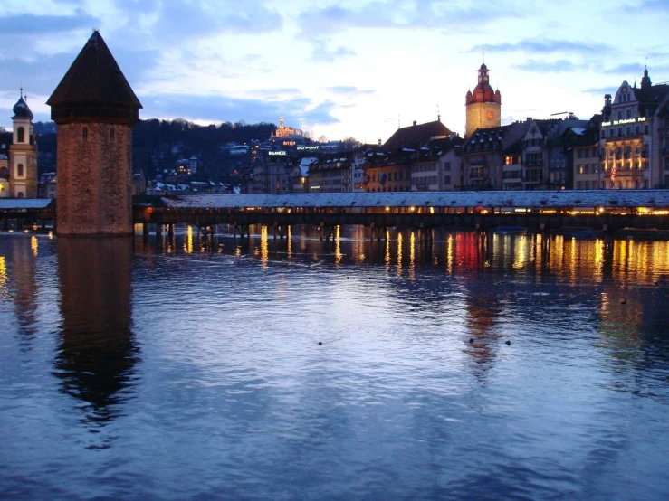 a river running through a city next to tall buildings