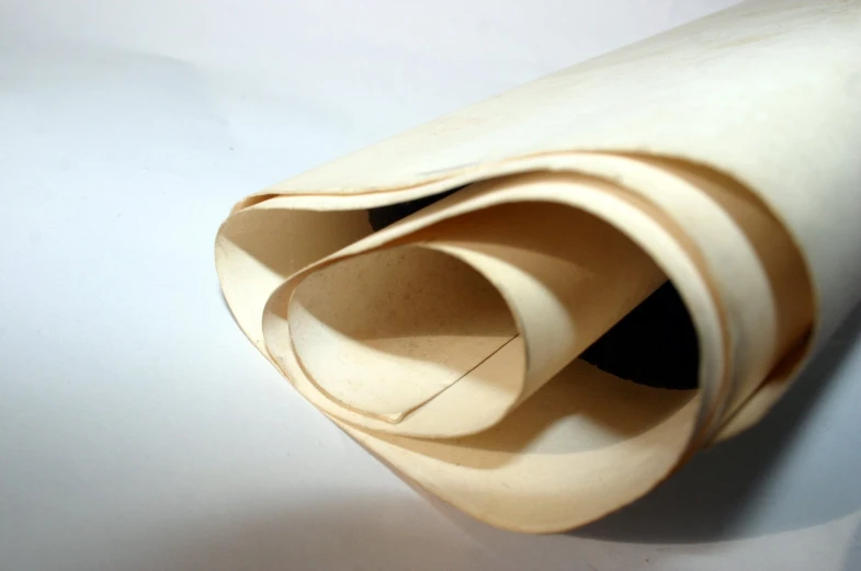 an open white rolled up material on a surface