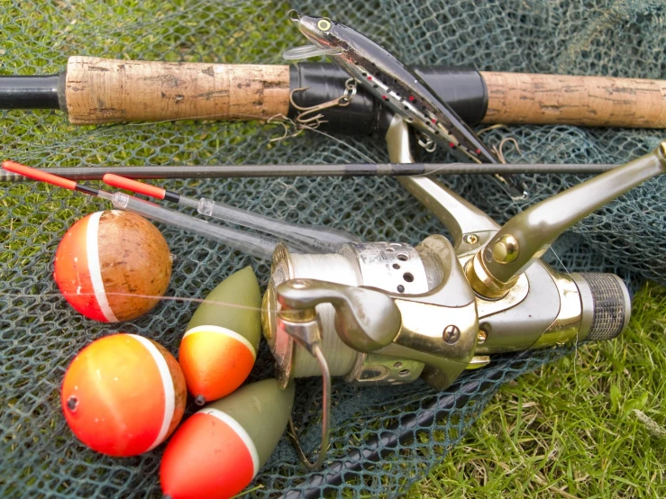 some fishing stuff sitting on a net