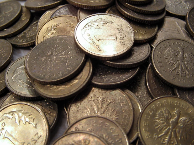 a pile of different size and metal coins