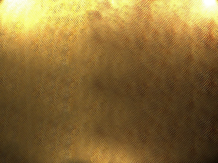 a close up of a golden metallic cloth
