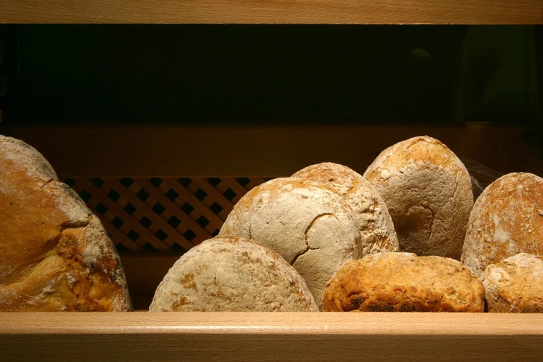 fresh baked bread is in a wooden box