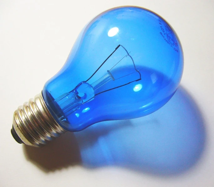 the light bulb has a blue glass surface