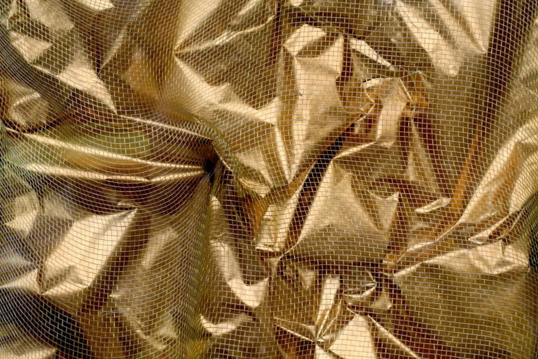 an artistic abstract design with a texture in gold