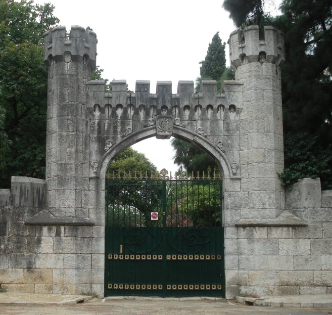 an entrance gate to the castle like building