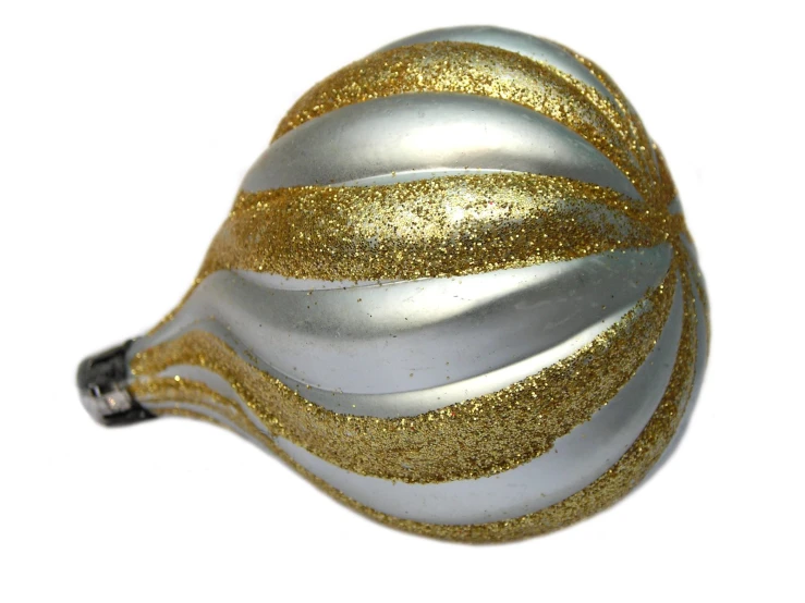 a glass ornament with gold glitter inside