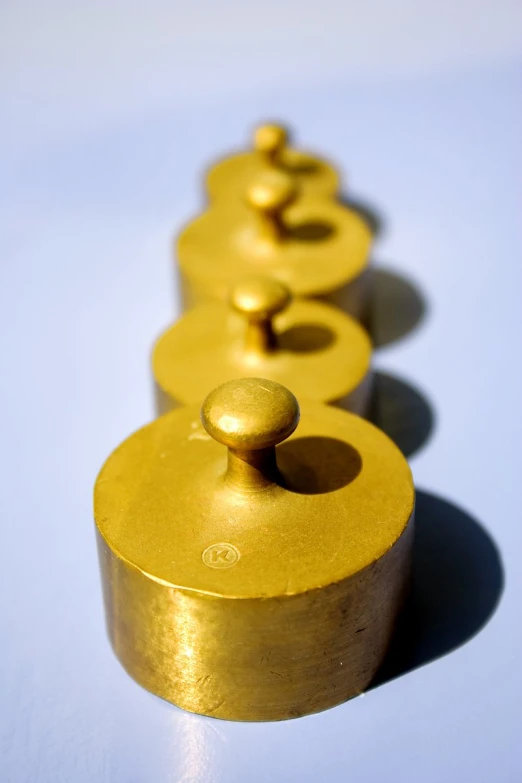 a row of gold circles sitting on top of a counter