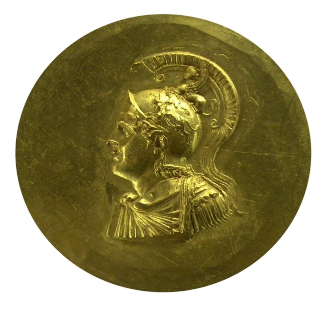 a gold coin that shows an image of a man's face