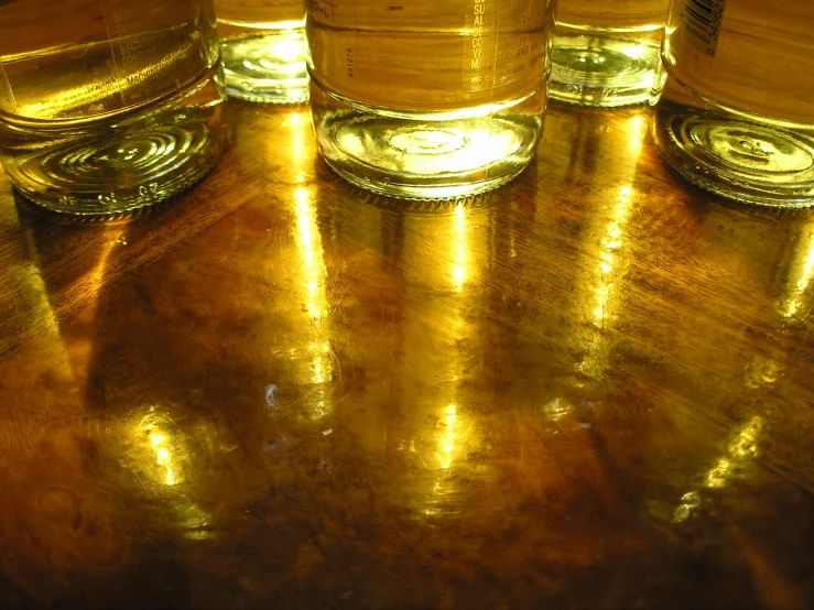 a number of clear glasses sitting on top of a table