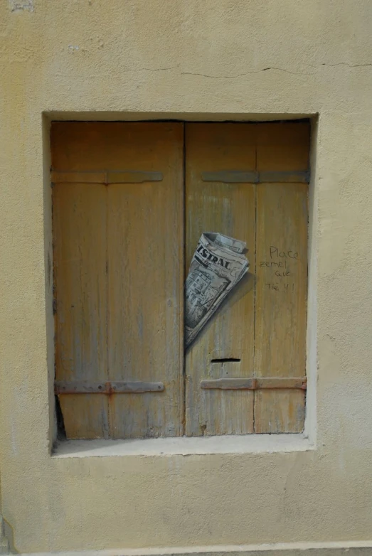 some sort of door with newspapers on it