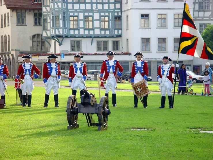 a group of people in blue and red outfits