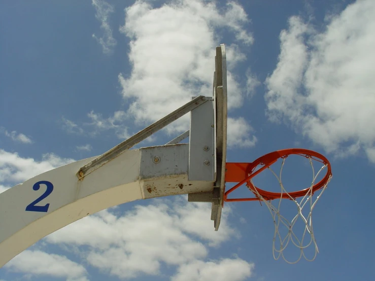 the basketball net is white with a red ball on it