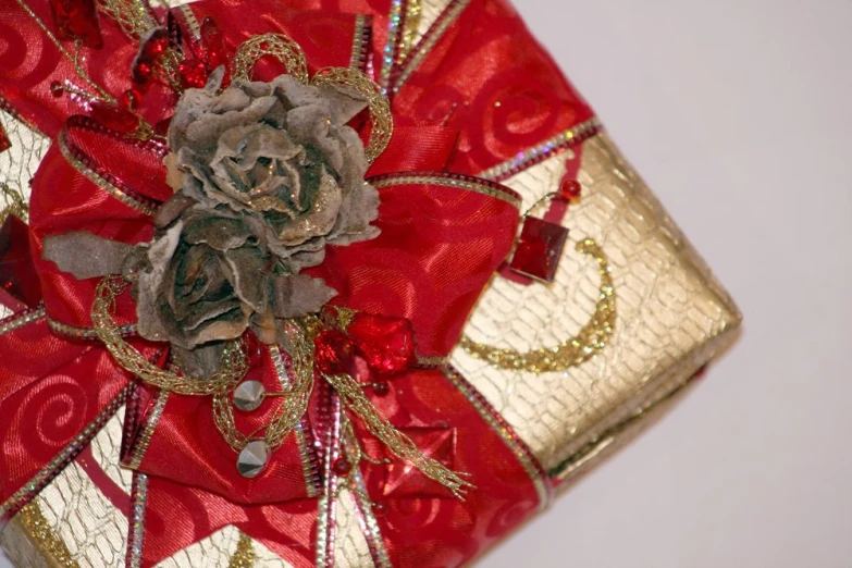 the rose is made from silver and gold foil
