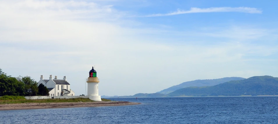 a large lighthouse standing in the middle of water