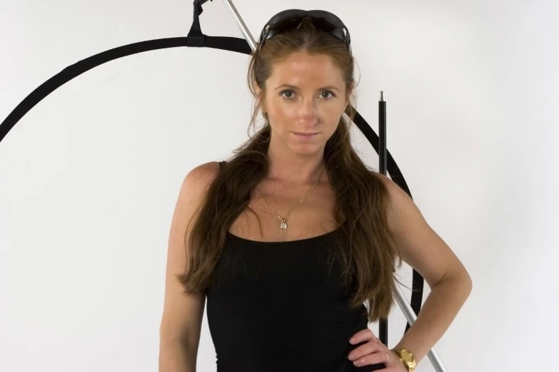 a woman standing in front of a white background