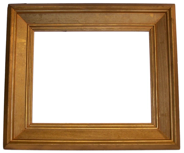 a small golden frame on the white wall