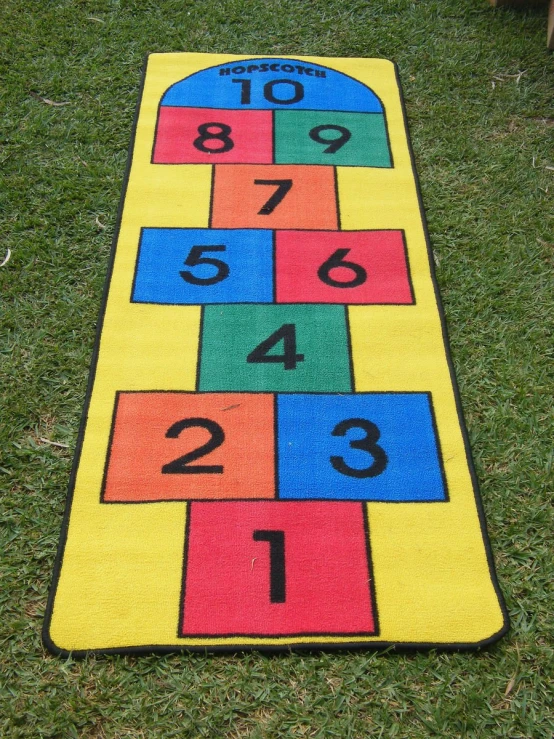 the colorful yard mat is decorated with numbers