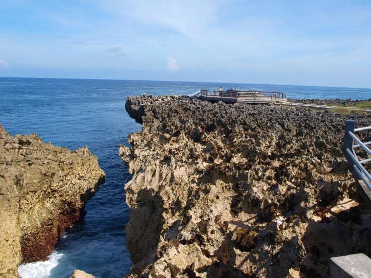 the view over the ocean from a rocky ledge