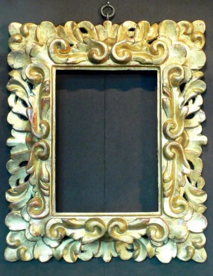 this is an ornate gold framed mirror
