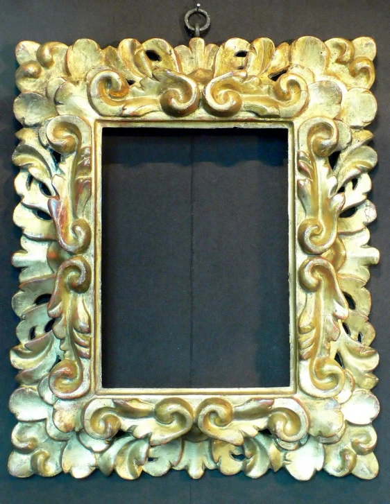 this is an ornate gold framed mirror