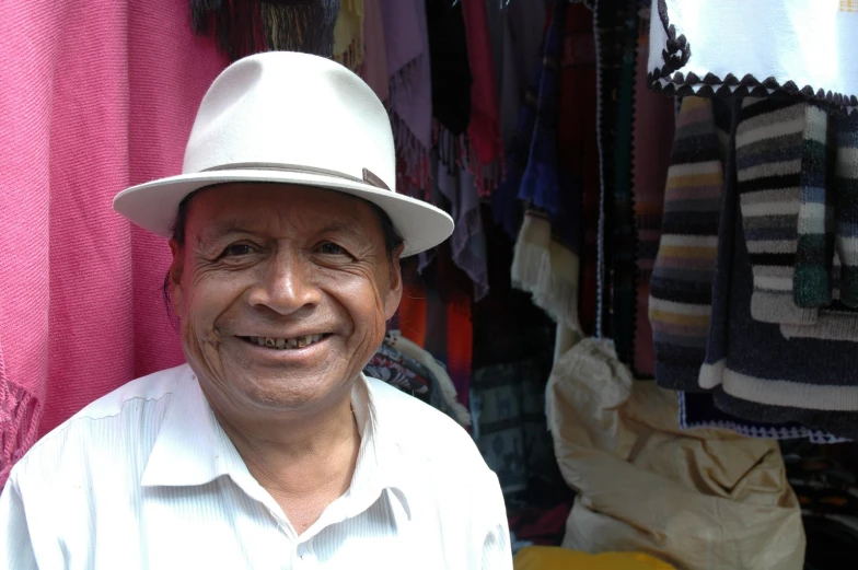 a person that is wearing a hat and shirt