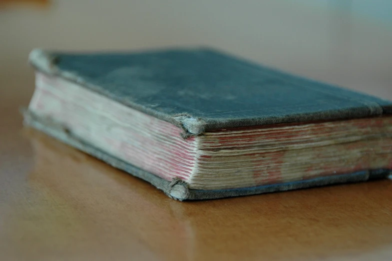 an old book on a wood surface