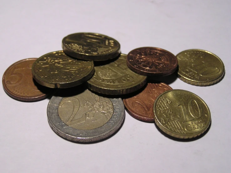 a bunch of coins sitting on top of a table