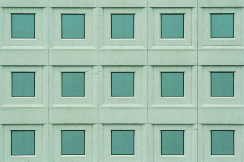 a close up of several windows on a building