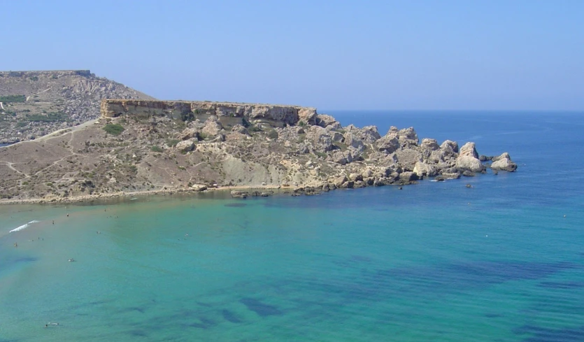 the water is very blue and green in this beach