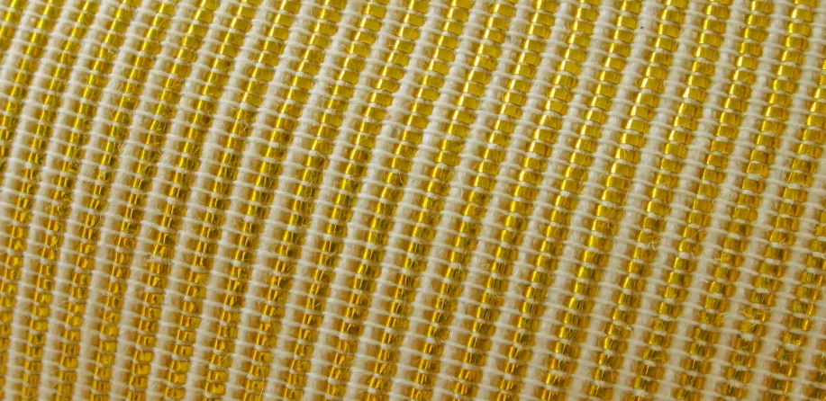 gold checkerboard texture with lines that reflect off the cloth