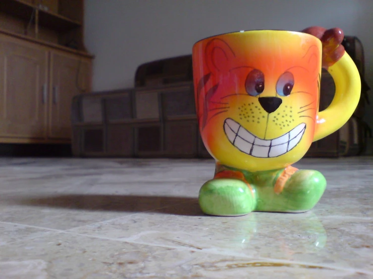 a colorful cup sitting on top of a white counter