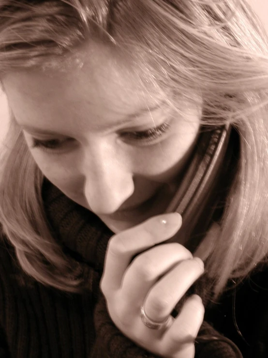 a woman on the phone and looking at her watch