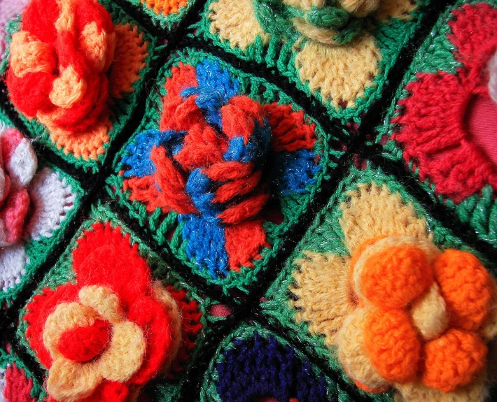 crochet flowers placed next to a white teddy bear