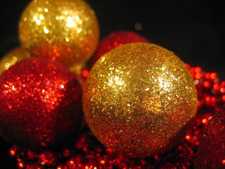 gold and red ornaments on a black surface