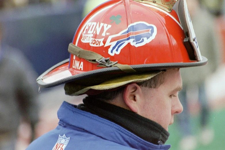 a man wearing a helmet at a football game