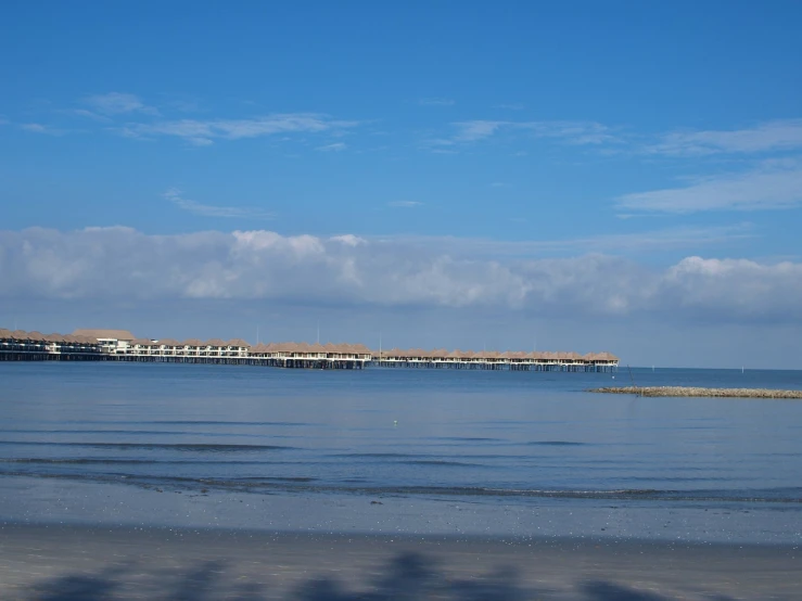 view of boats in the water on a beach