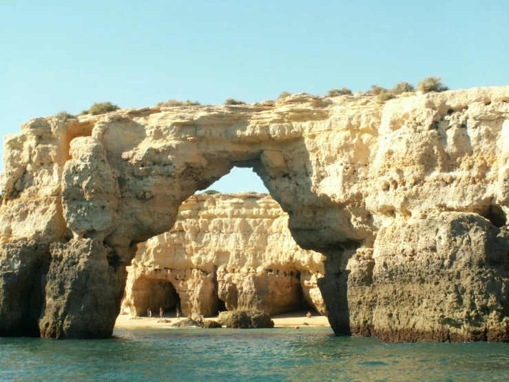 the sea cliffs are near the shore where the rocks face