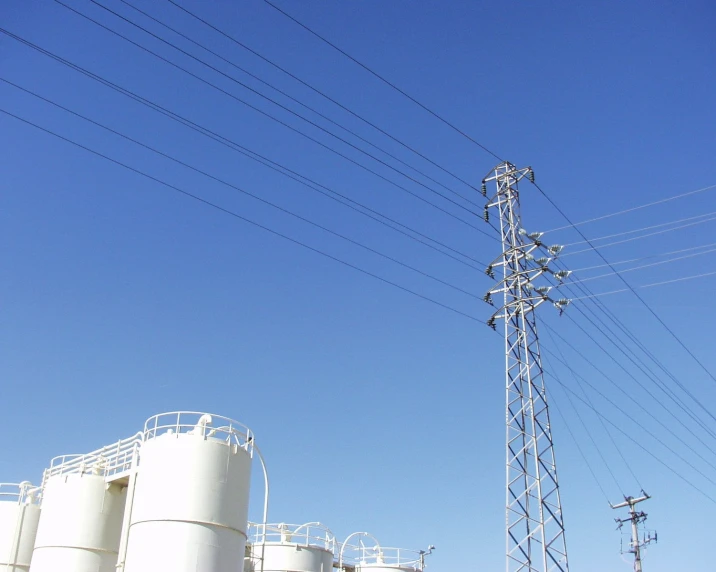 a power pole near an energy storage tank