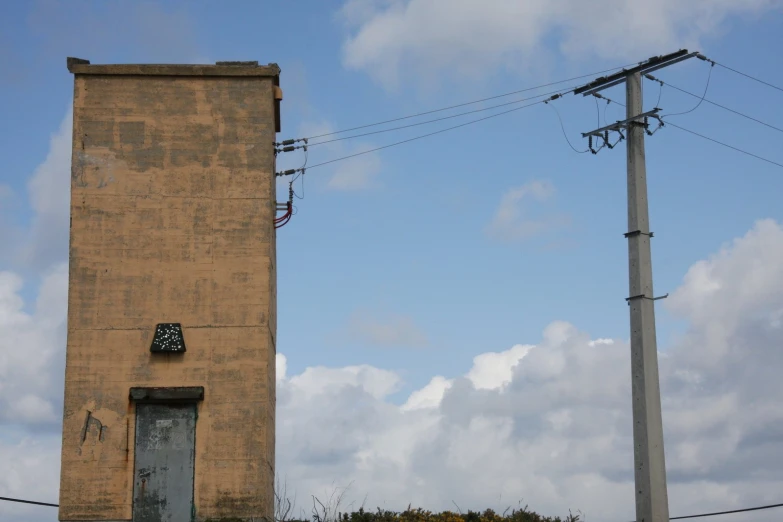 an old clock on the building with a sky background